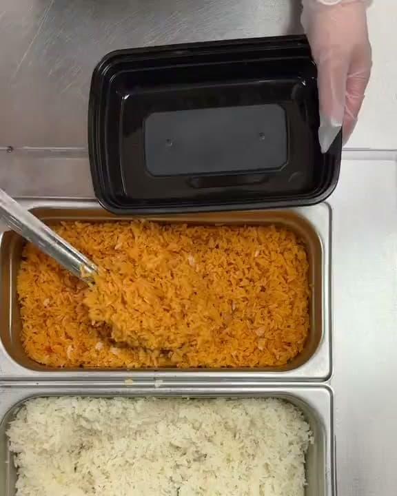 Top-down view of a burrito bowl being built along the Santa Fe line